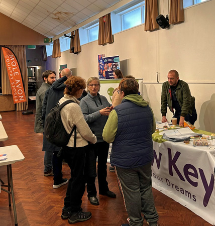 Job seekers talking to employers at the West Devon Employment Fair in January 2024