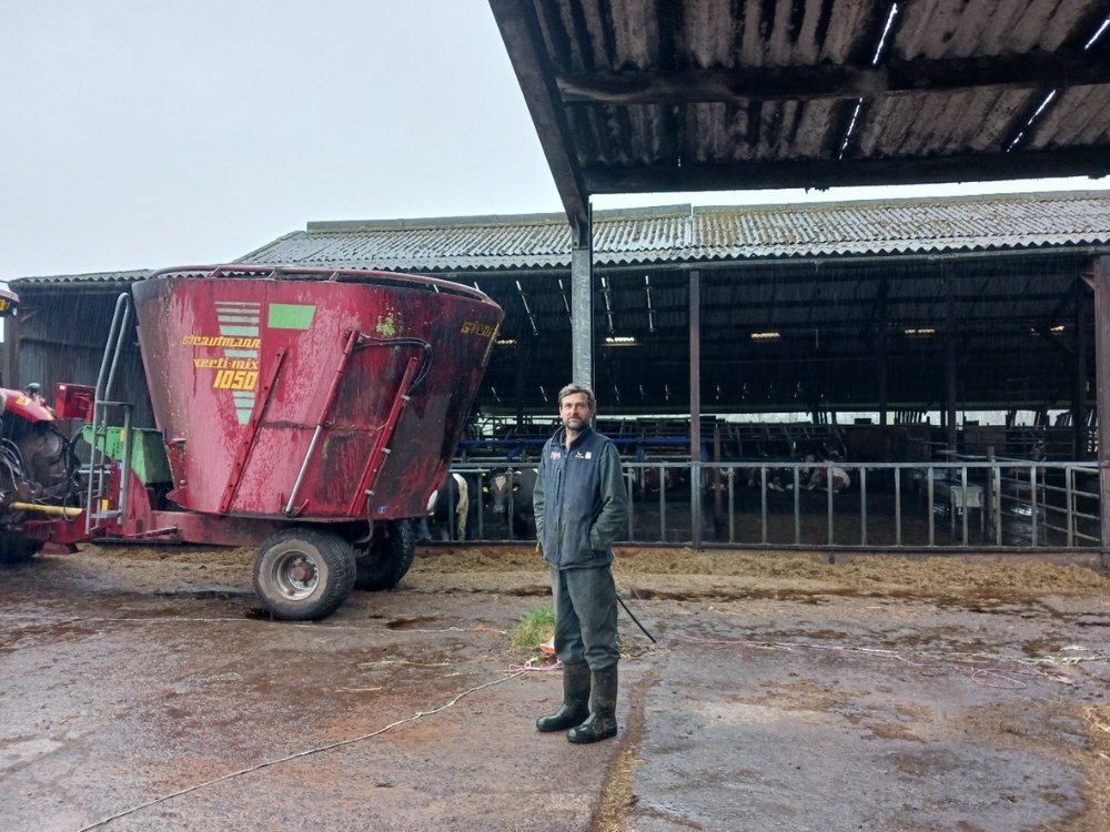 Cattle farmer in his farm yard during an on-farm consultation with Business Information Point