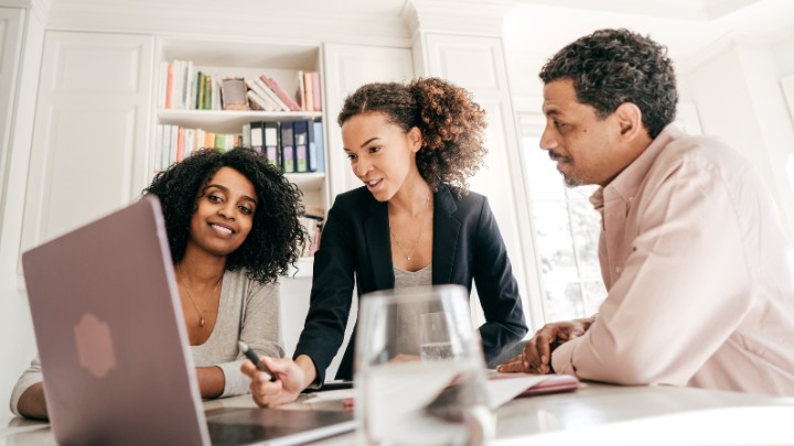 Small business owners getting advice from an advisor