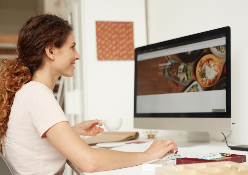 small business owner working on her website