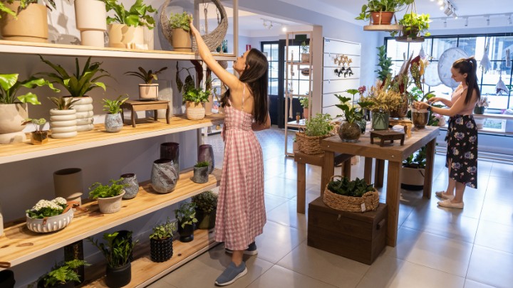 Two small business owners in their shop